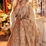 gold bridal lehenga with trail hand embellished