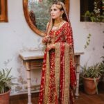 red bridal dress with gold hand embellishment