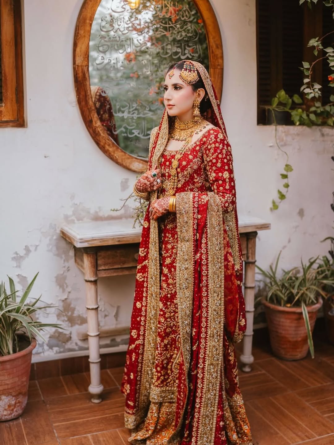 red bridal dress with gold hand embellishment